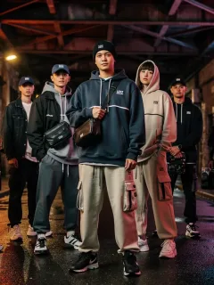 Diverse models in unique streetwear, urban backdrop